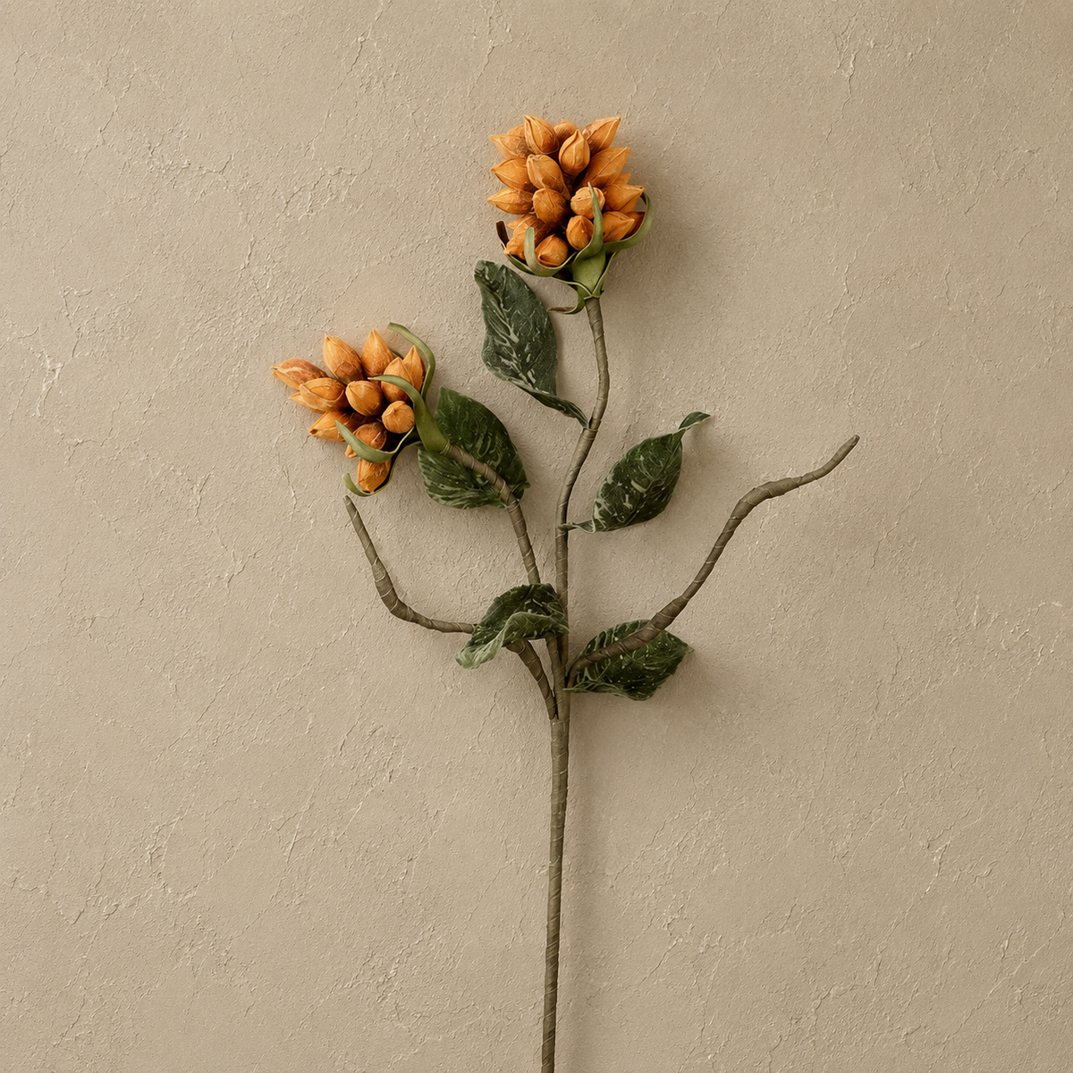 artificial stem with 2 orange pod bundles and deep green leaves shown on a light beige background
