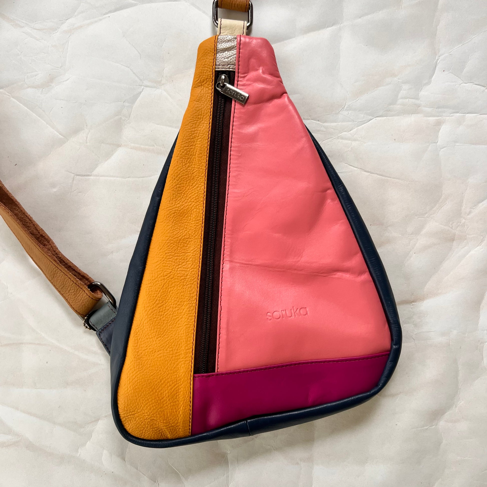 front view of pink roxi sling bag.
