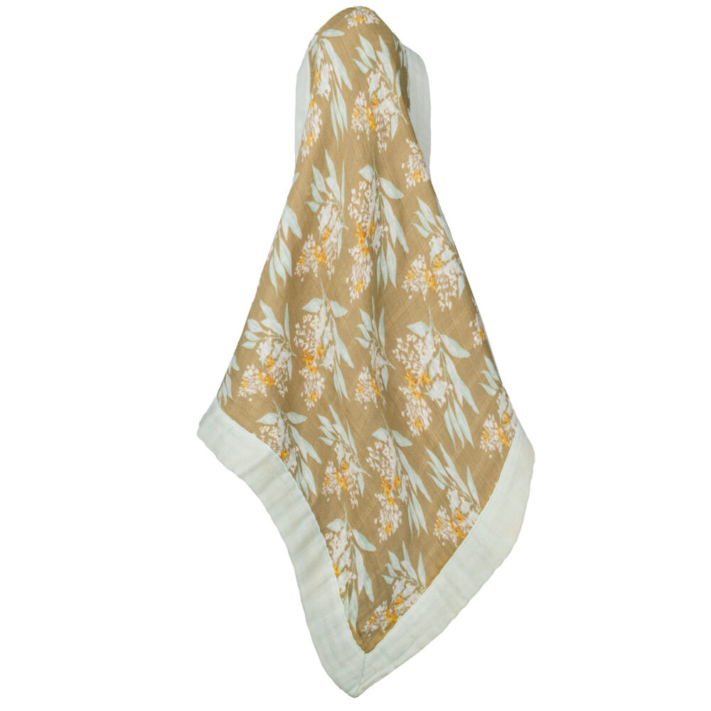 golden floral lovey draped on a white background.