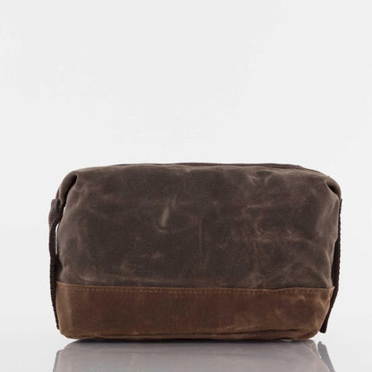 front view of brown waxed canvas dopp kit