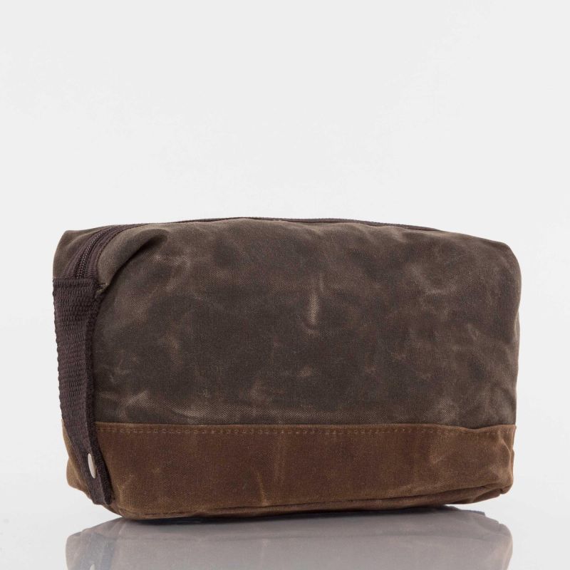 angled view of brown waxed canvas dopp kit