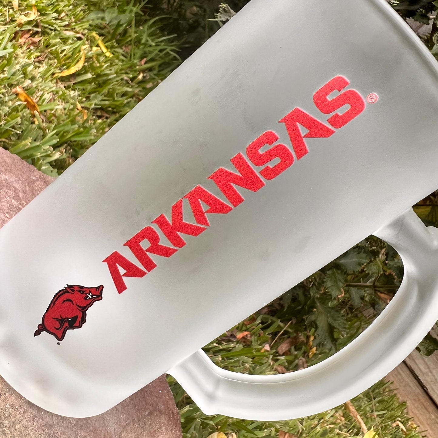 Close up of frosted glass Arkansas mug.