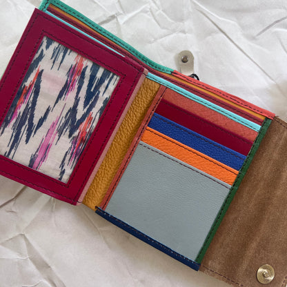 seafoam rings wallet laying flat showing colorful card slots