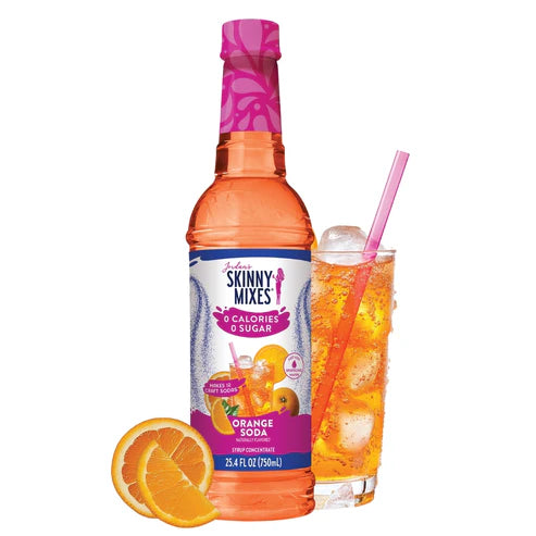bottle of Orange Soda Sugar Free Syrup arranged with orange slices and a beverage with a straw