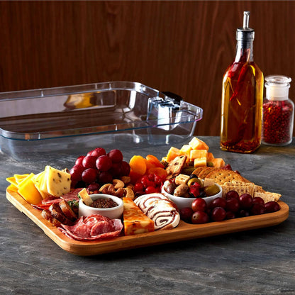 6 Section Build A Board filled with eat, cheeses and fruit set on a counter with the lid in the background