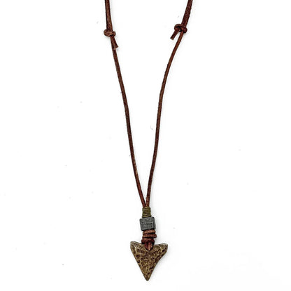 Necklace with an arrowhead pendant on a white background