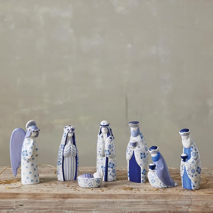 Blue & White Floral nativity set arranged on a table with gold ribbon
