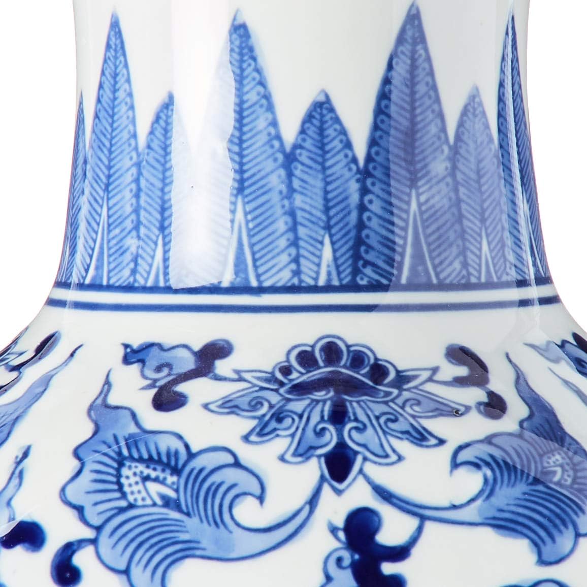 close-up of white vase with blue floral design.