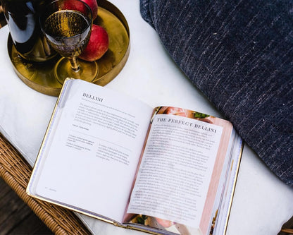 open bubbly book showing recipe for bellini.