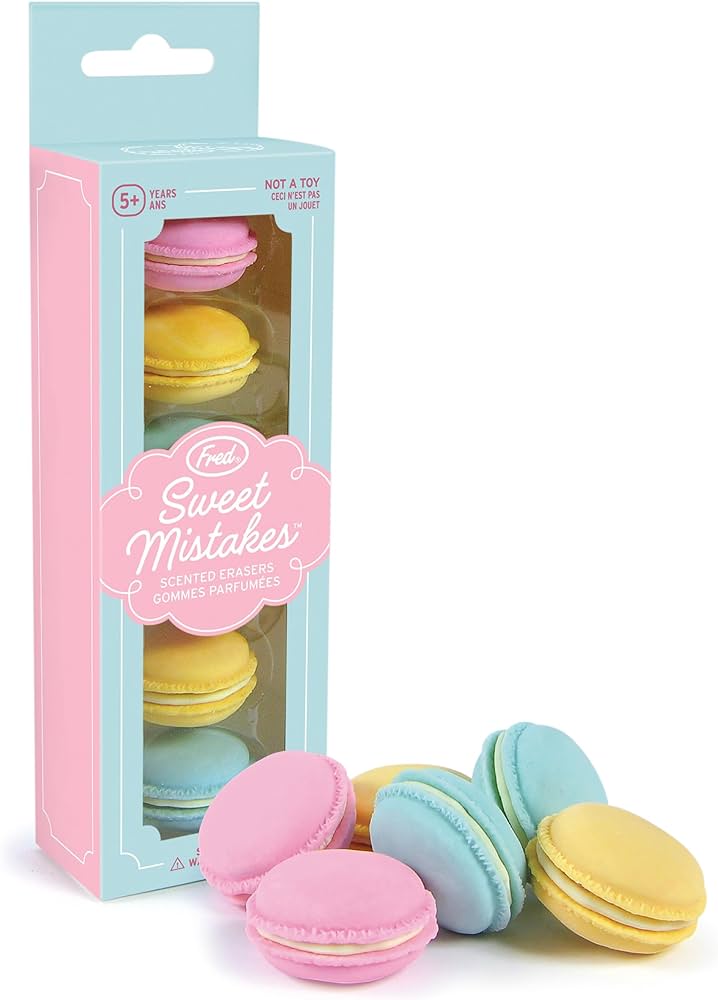 boxed set of macaron erasers with several piled next to it.