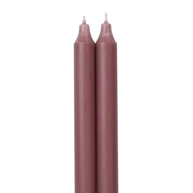 2 rosewood colored tapers on a white background.