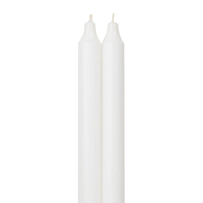 2 pure white taper candle next to each other