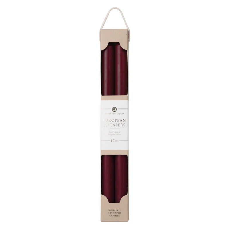 2 wine colored tapers in box packaging.