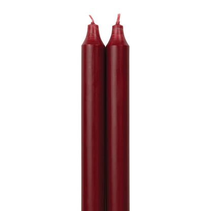 2 crimson colored tapers on a white background.