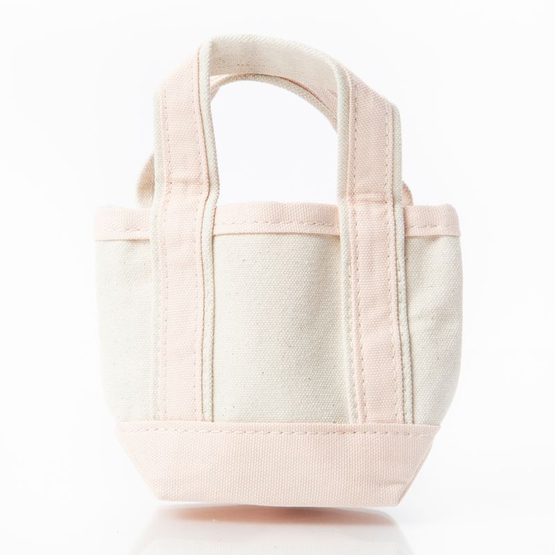 off white mini tote bag with pale pink handles and trim