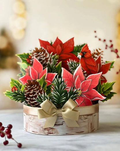 Birch Poinsettia Pop-Up Bouquet set on a table