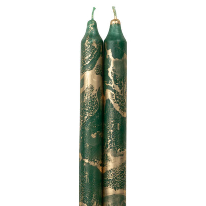 2 green colored tapers with gold swirls on a white background.