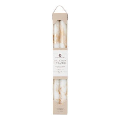 2 pure white and gold marbled taper candles in their packaging