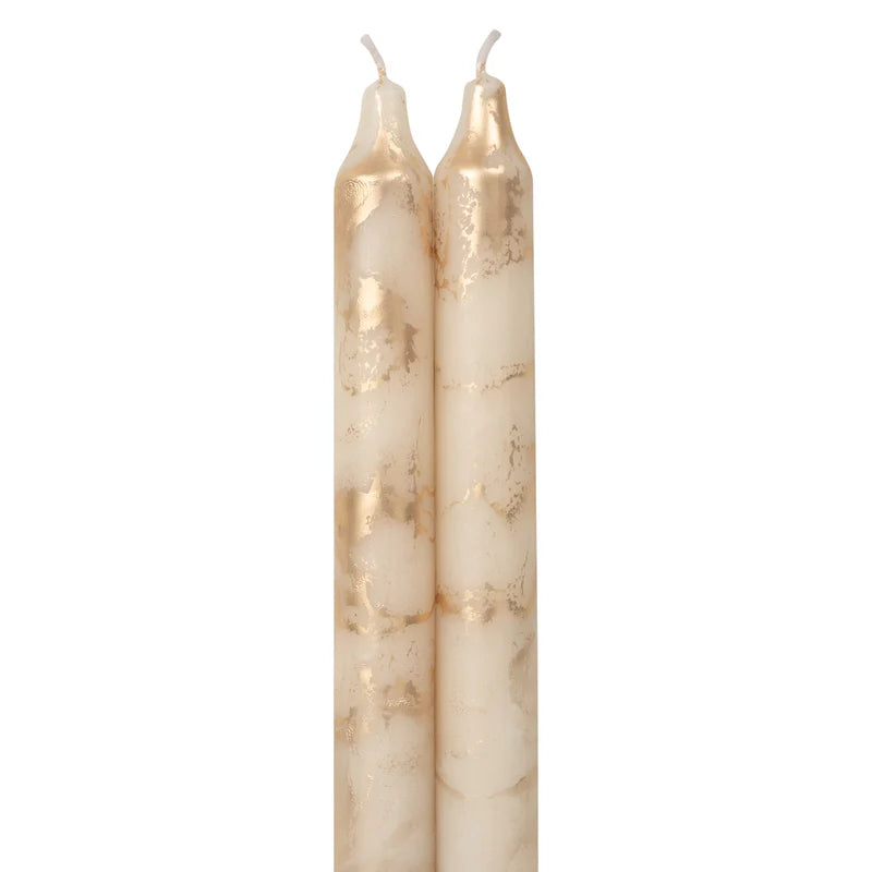 2 cream colored tapers  with gold swirls on a white background.