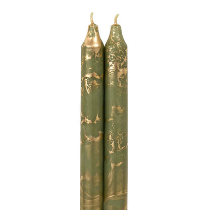 2 moss green colored tapers with gold swirls on a white background.