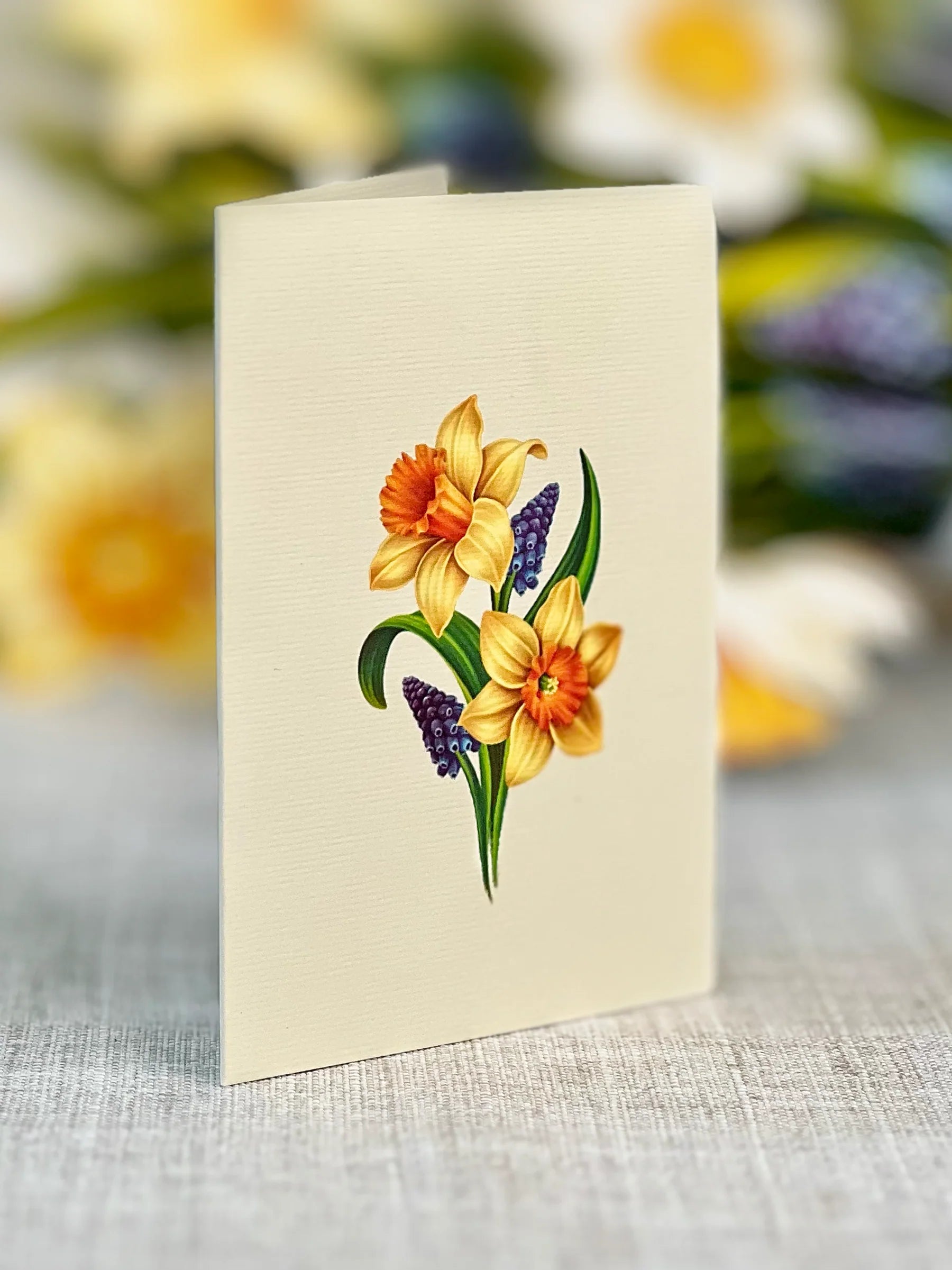 close-up of enclosure card with daffodils printed on it.