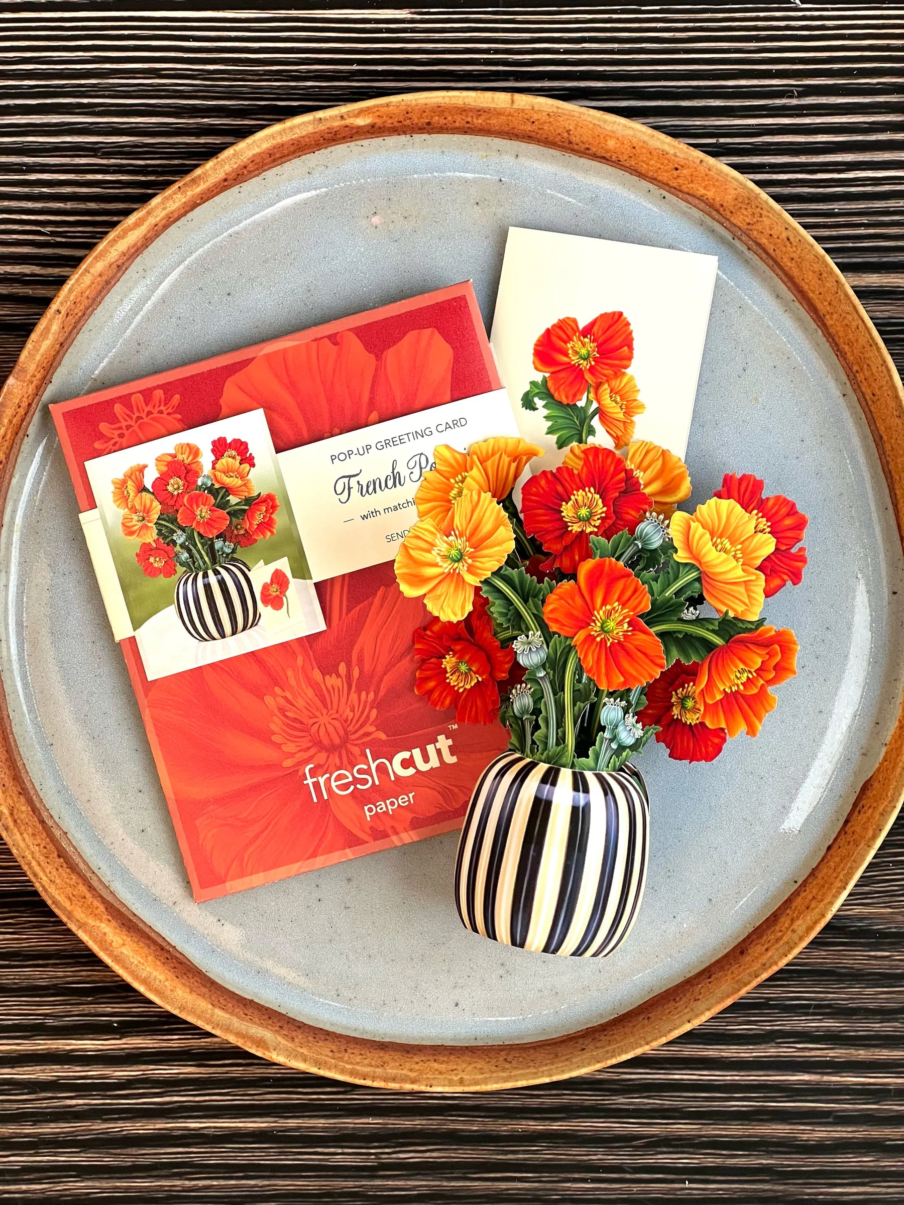 French Poppies bouquet, enclosure card, and mailing envelope arranged on a tray.