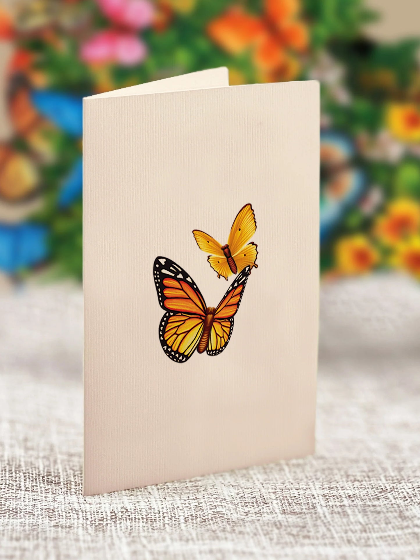close-up of enclosure card with two butterflies printed on it.