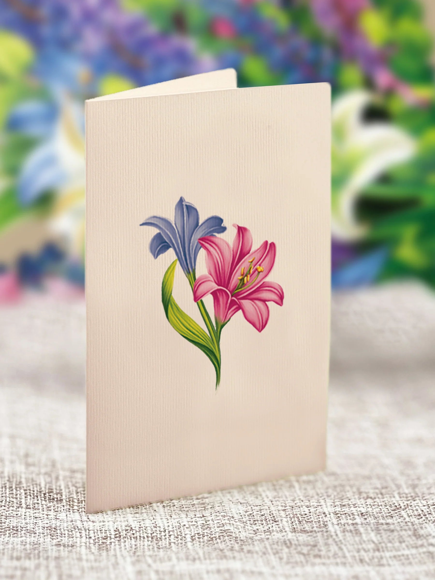 close-up of enclosure card with lilies printed on it.