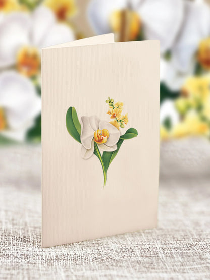 close-up of enclosure card with a white orchid printed on it.
