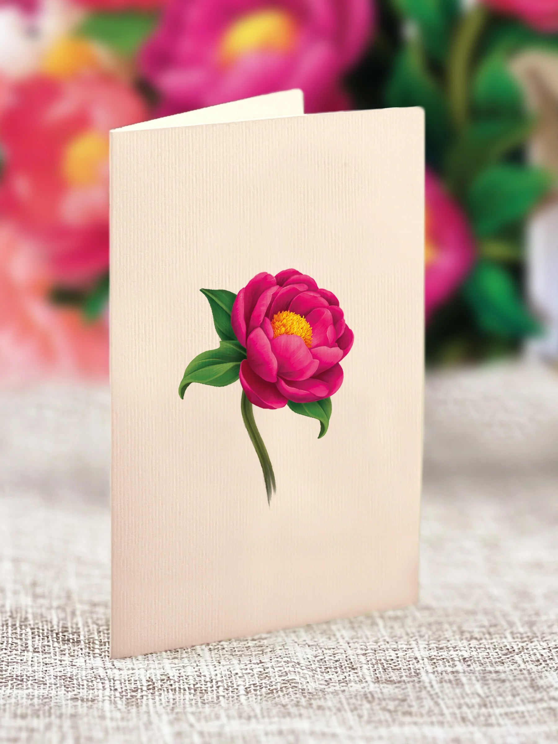 close-up of enclosure card with a peony printed on it.