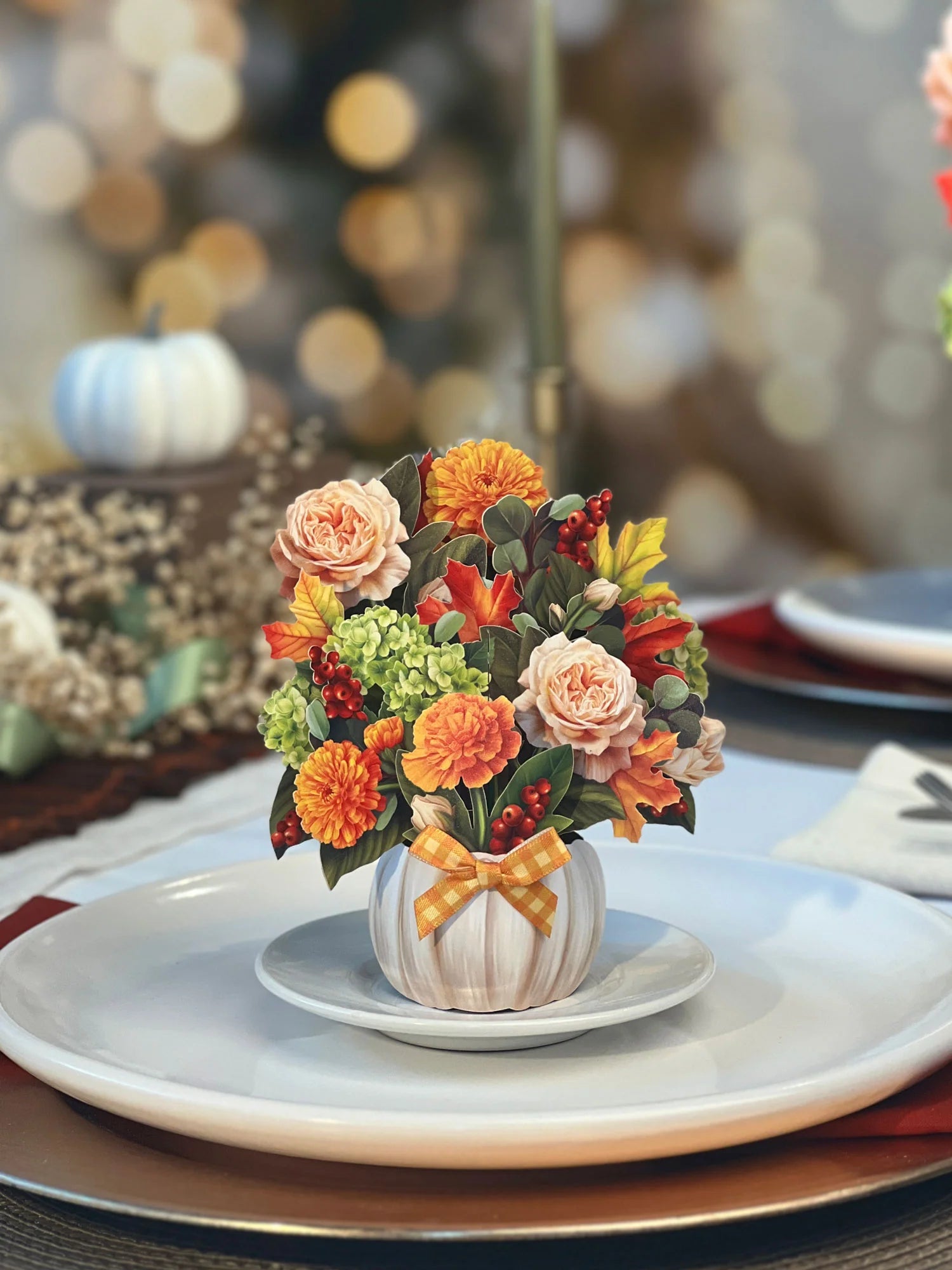 pumpkin spice Pop-Up Greeting Card set on a plate on a dinner table.