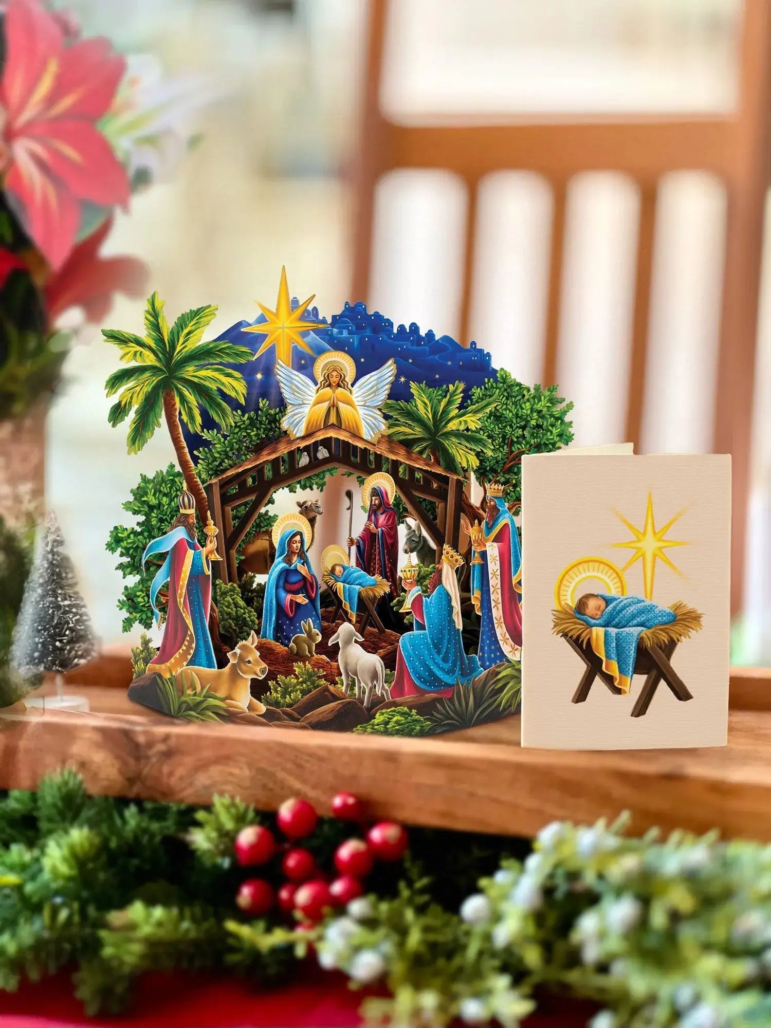 Mini Nativity Pop-Up Card set on a table with its enclosure card