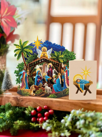 Mini Nativity Pop-Up Card set on a table with its enclosure card