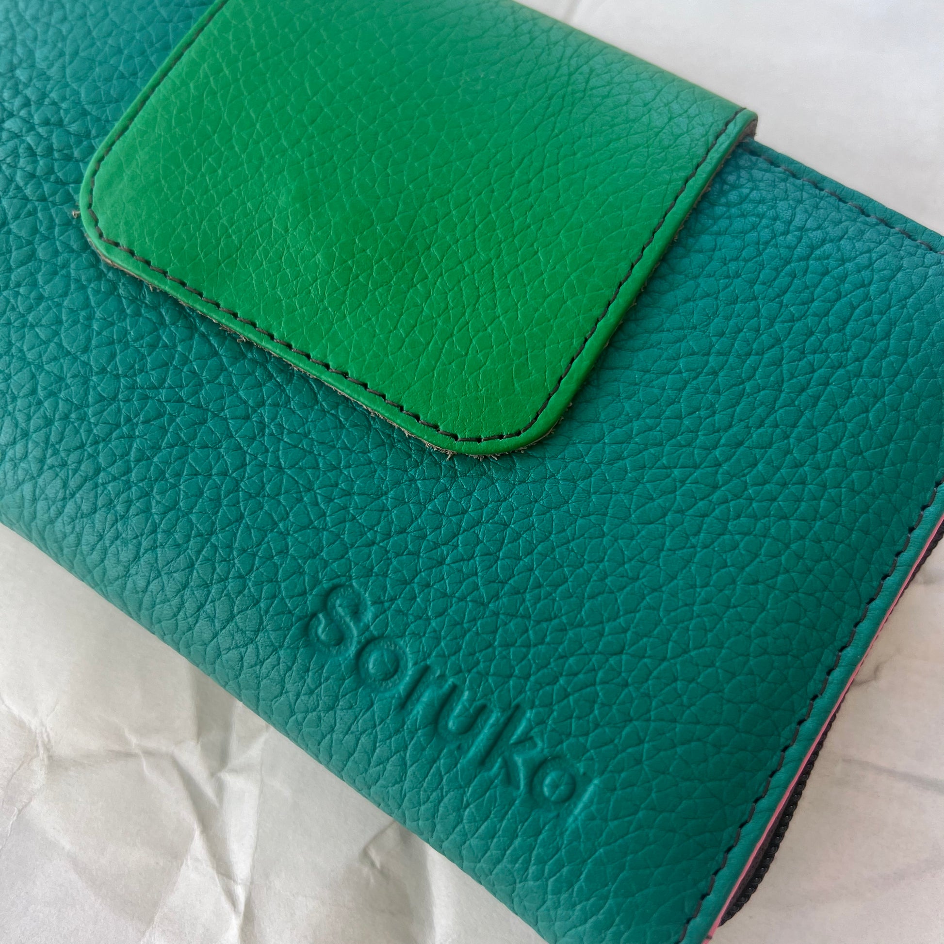 close-up of green Beatrice Clutch
