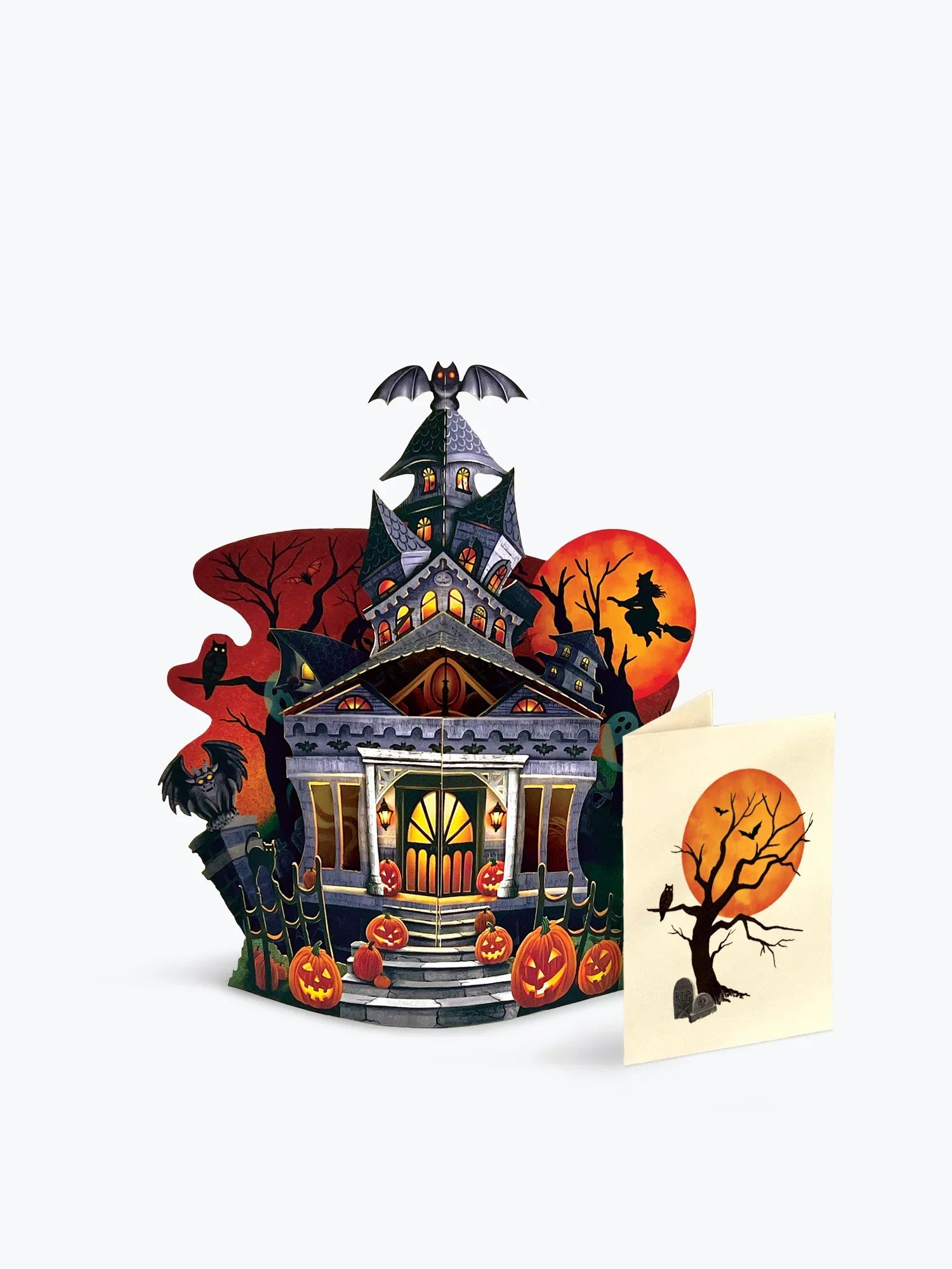 Halloween-themed pop-up card with a haunted house design on a white background