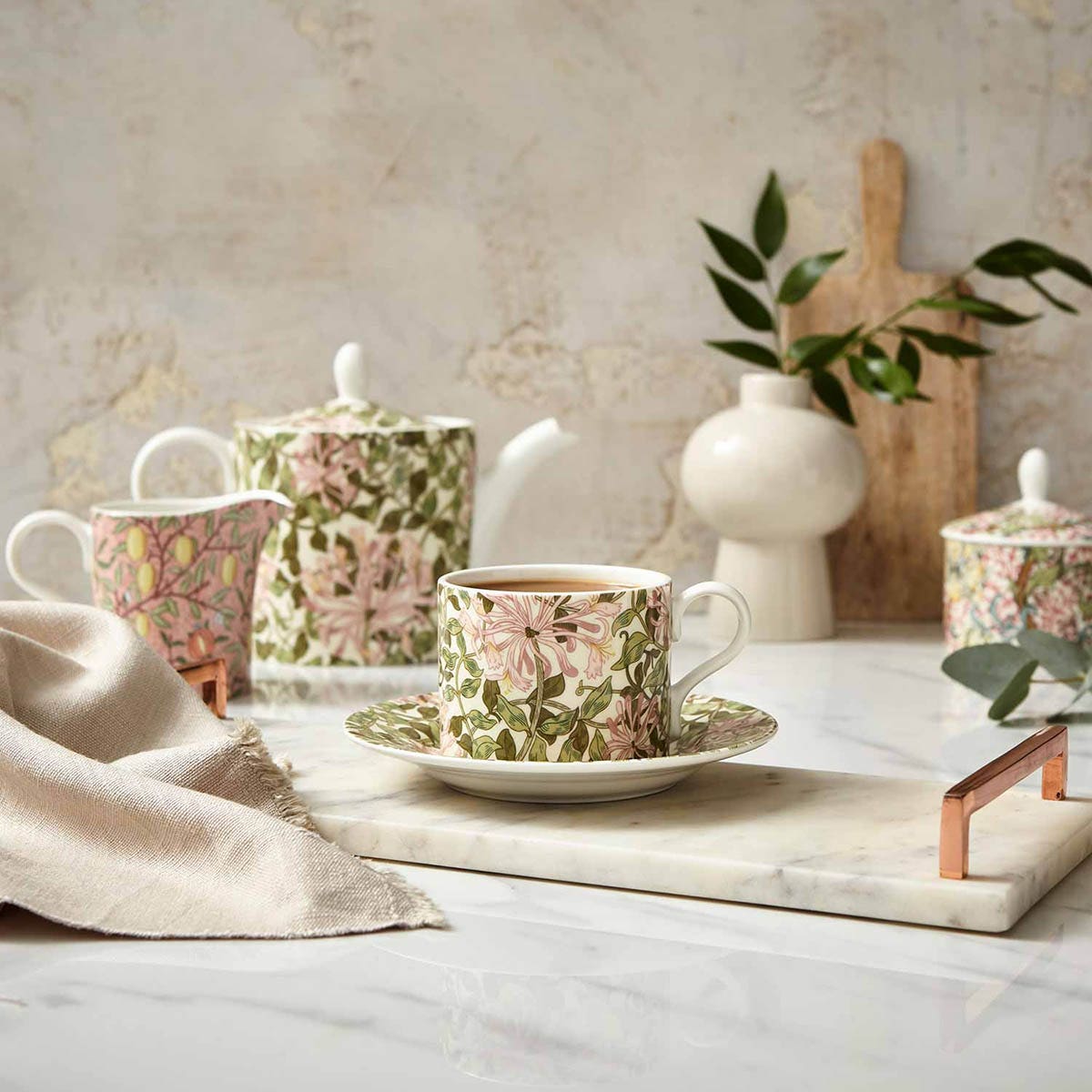 honeysuckle teacup & saucer on a decorated counter