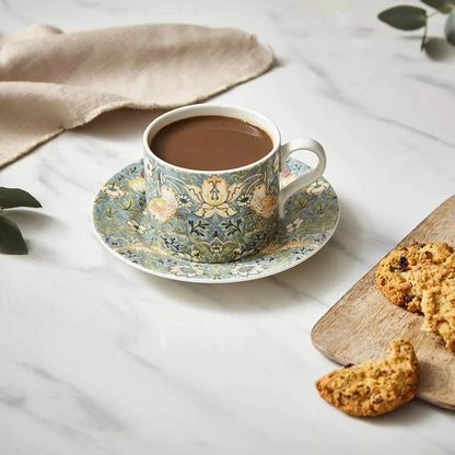 styled shot of Strawberry Thief Teacup & Saucer filled with tea