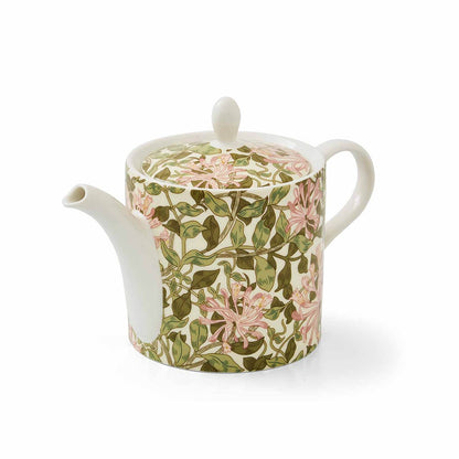 angled view of the honeysuckle teapot on a white background
