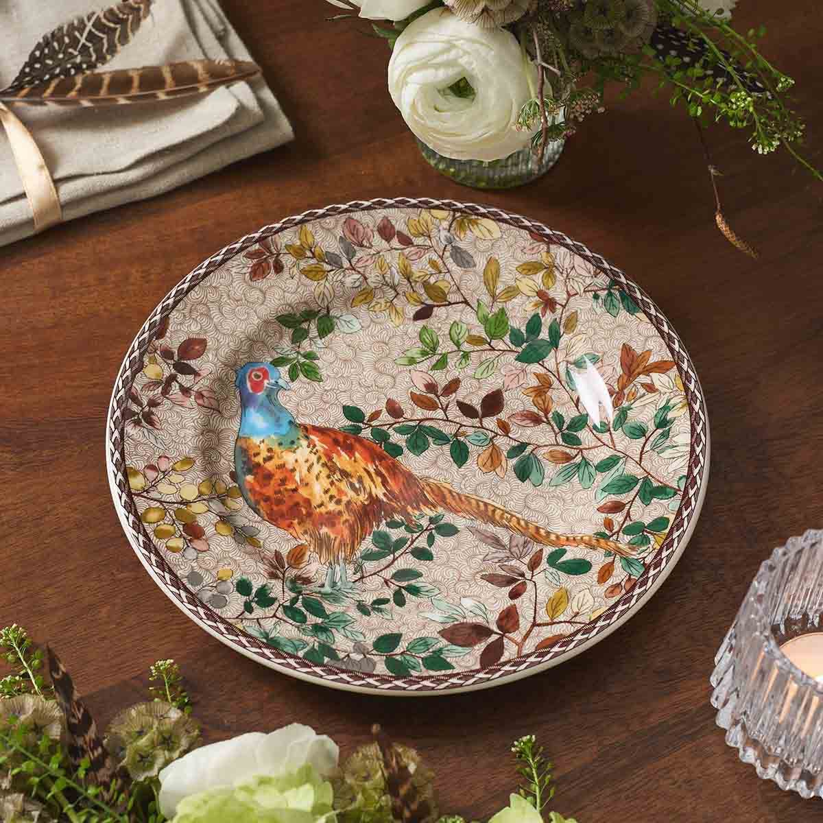 pheasant salad plate set on a wooden table with florals and table linens