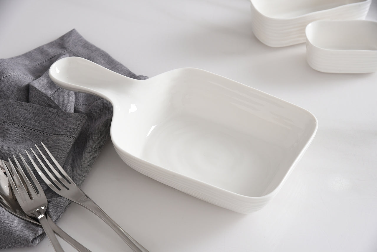le blanc serving dish with handle on a set table