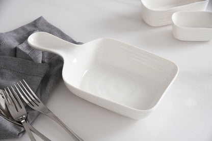 le blanc serving dish with handle on a set table