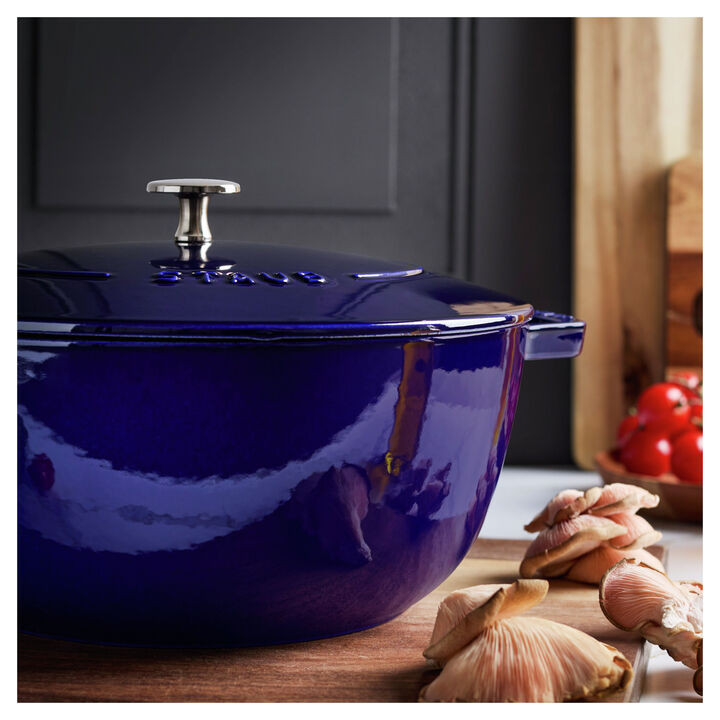 Close up of dark blue French oven set on a kitchen countertop