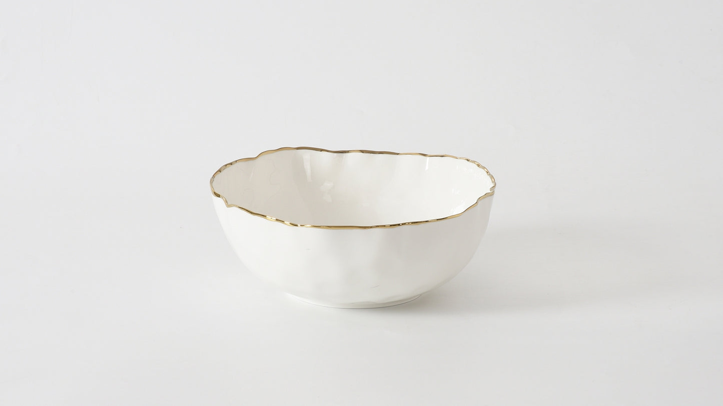 portofino medium bowl with gold rim shown o a white background