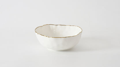 portofino medium bowl with gold rim shown o a white background