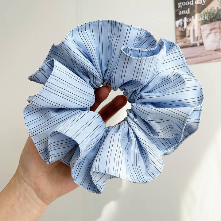 blue pinstripe scrunchie being held