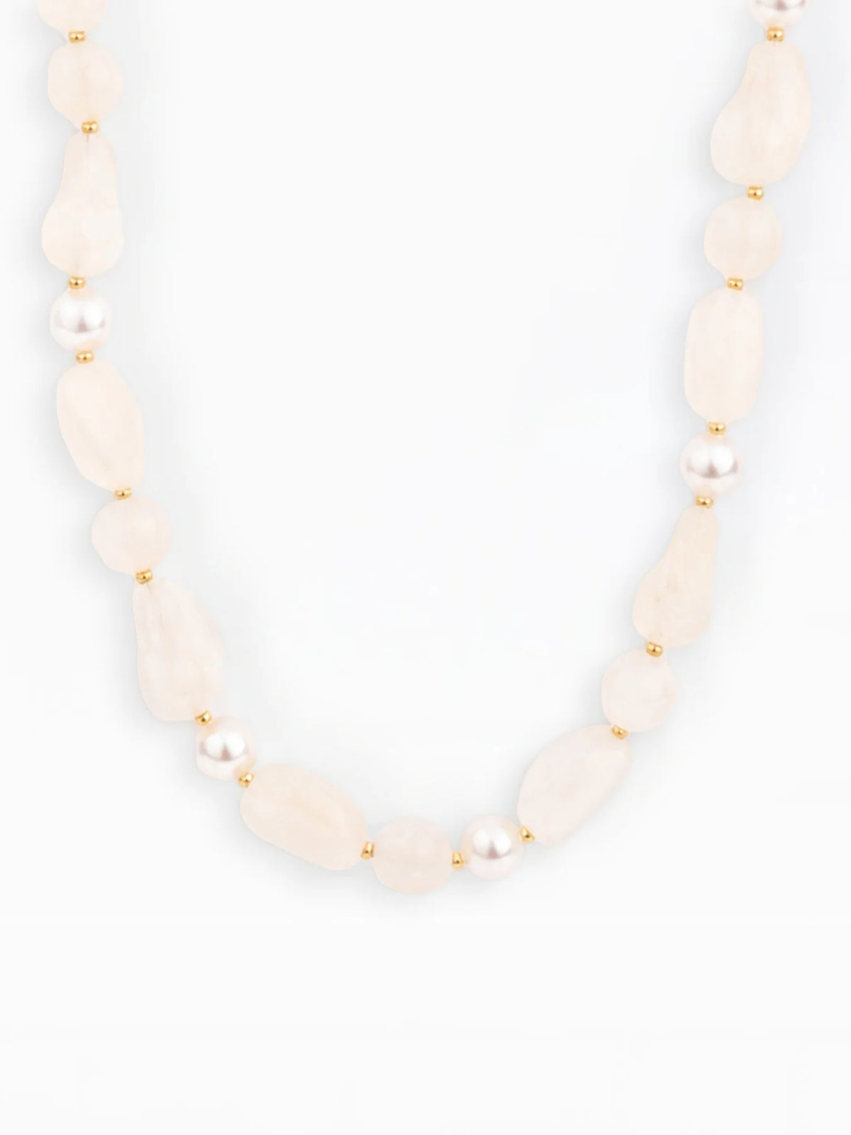 A beaded necklace featuring irregular pale creamy-white beads, small white pearls, and gold spacer rings, displayed against a clean white background.