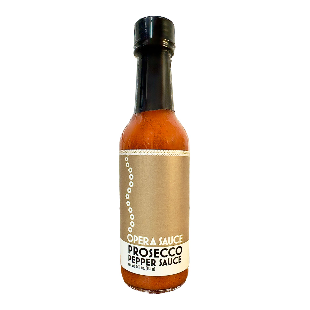glass bottle of Prosecco Pepper Sauce shown on a white background