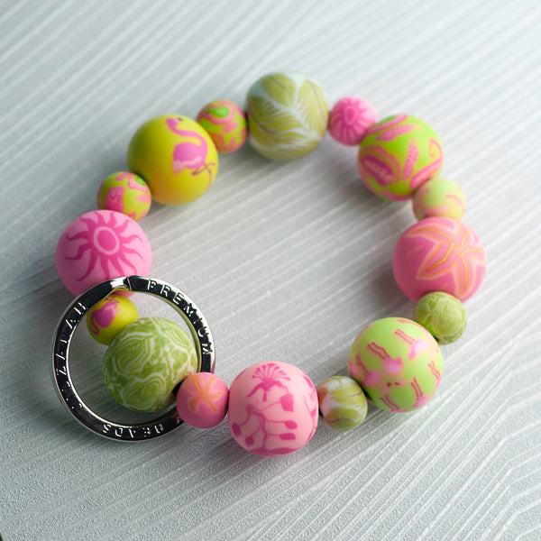 pink and green patterned bead keychain wristlet.