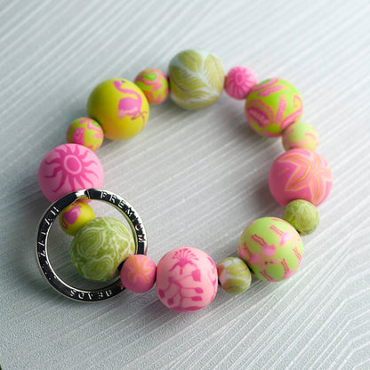 pink and green patterned bead keychain wristlet.