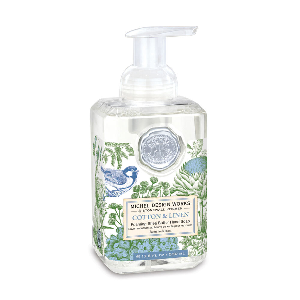 bottle of Cotton & Linen Foaming Hand Soap with a label printed with blue birds and foliage.